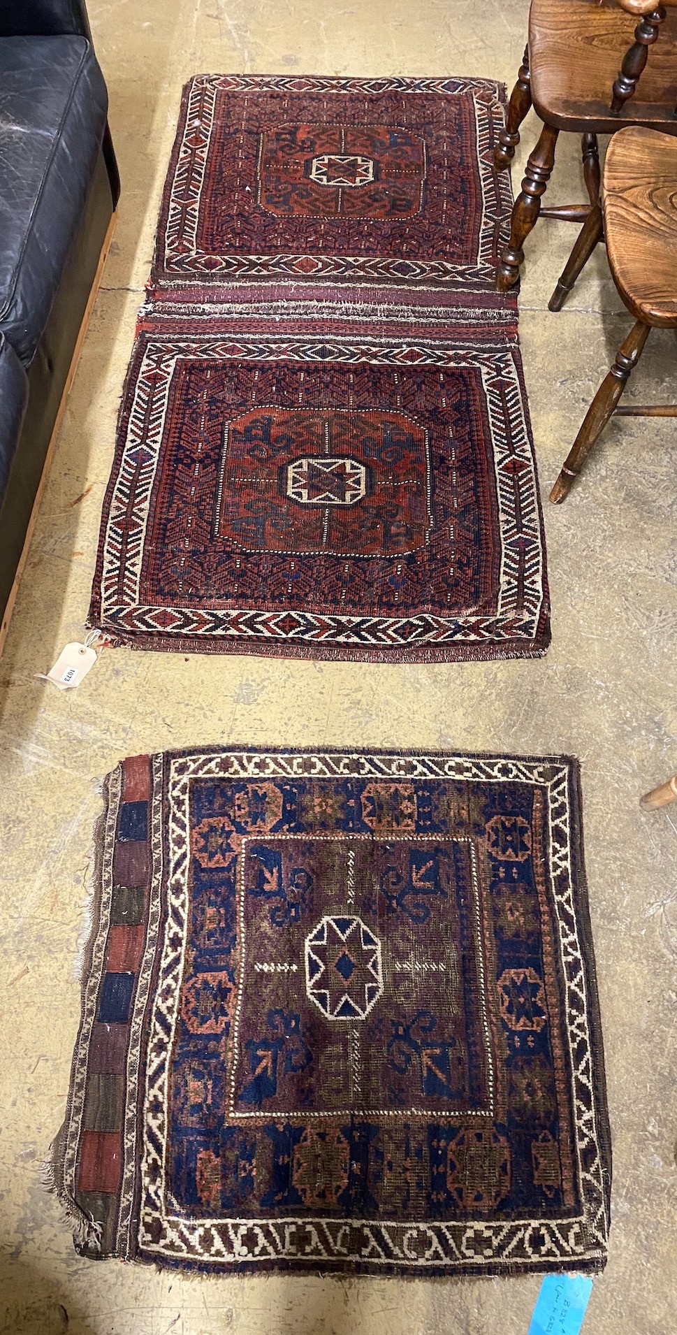 An antique Belouch saddlebag rug, 183 x 84cm and a single bagface, 78 x 76cm